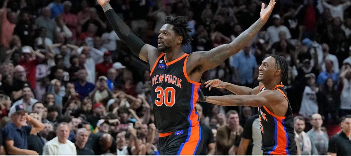Randle, celebrating a win in Miami with Immanuel Quickley, has worn the No. 30 since high school